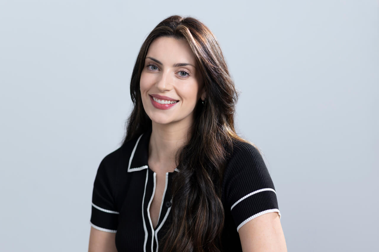 Authentic and approachable studio headshot of a Melbourne professional. Relaxed, authentic Melbourne professional headshot in a studio