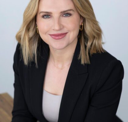 Smiling Melbourne professional in a studio setting