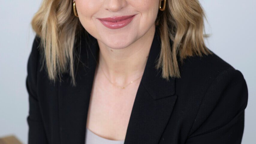Smiling Melbourne professional in a studio setting