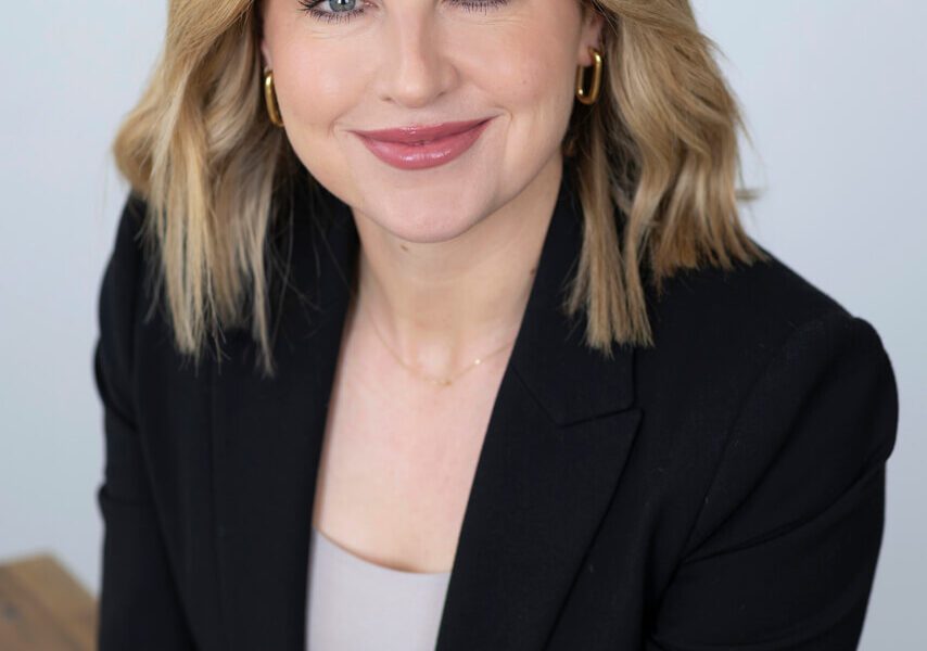 Smiling Melbourne professional in a studio setting