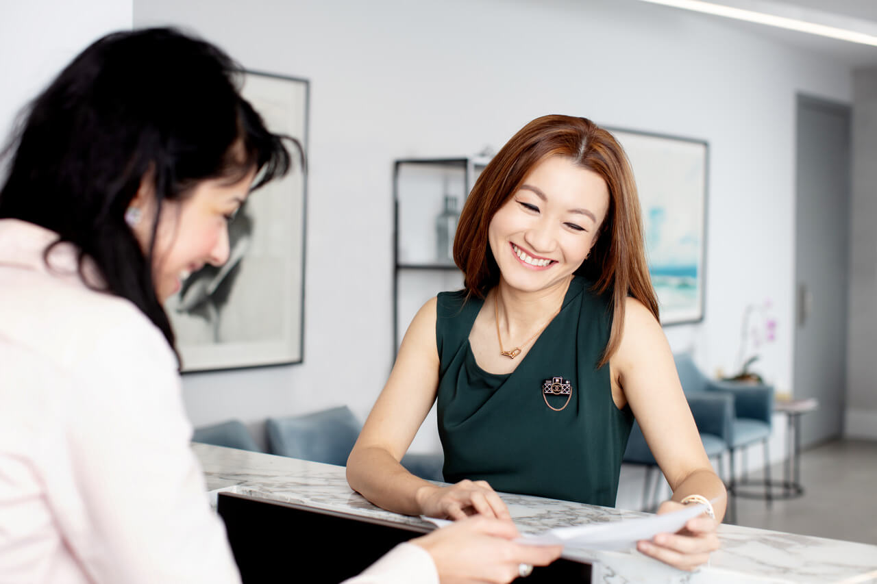 Marketing Photography for Health Clinics Doctor and receptionist chatting in reception of a Medical Clinic in Melbourne
