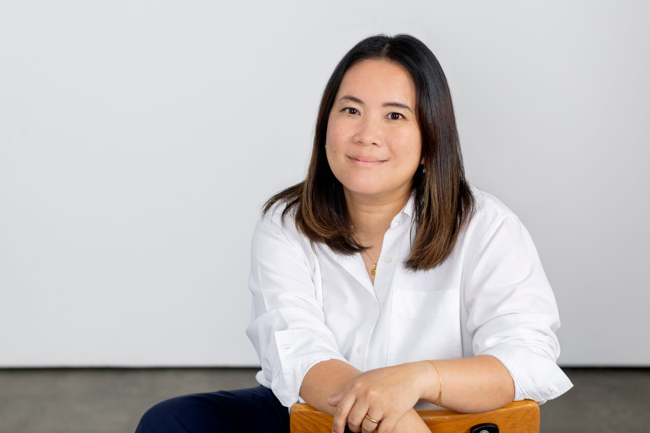 Relaxed headshot on chair in a Melbourne Studio